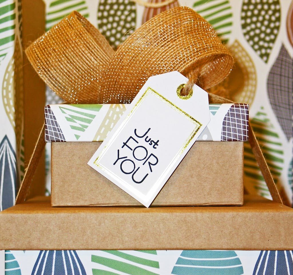 A neatly wrapped gift box with decorative ribbon and 'Just For You' tag, perfect for celebrations.